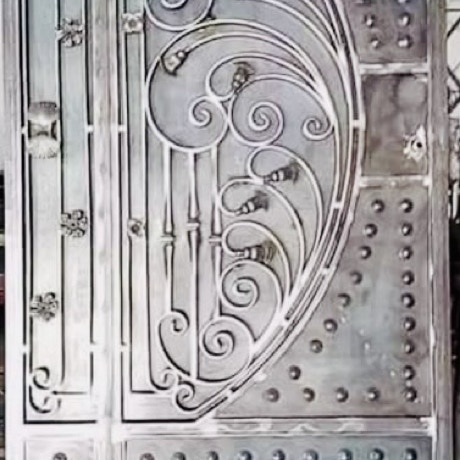 Intricate black and white design of a vintage wooden church door in Mönchengladbach, Germany.